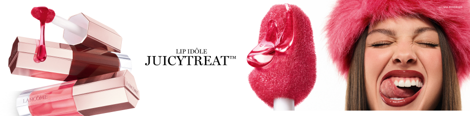 Lancôme Lip Idôle Juicy Treat Lippenprodukte mit glänzenden rosafarbenen Verpackungen, daneben eine Frau mit pinker Mütze und glänzendem Lippen-Make-up.