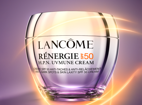 Lancôme Rénergie H.P.N. UVmune SPF50 Cream in einem eleganten violetten Tiegel mit goldenem Deckel, umgeben von einem leuchtenden Lichtschein.